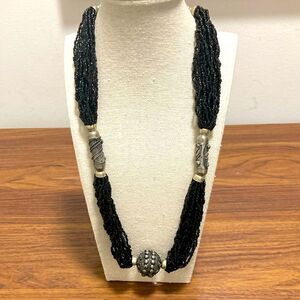 Vintage Necklace with Multi Strand Black Glass Beads and Bronze Metal Details.
